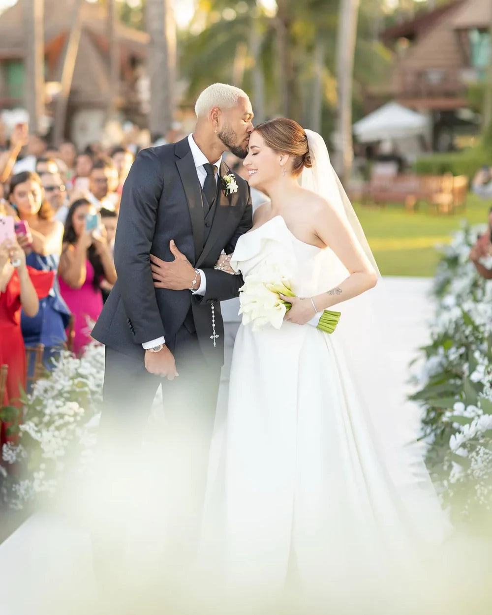 Groom wearing Michael frackowiak Dress